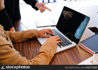 The Casual business woman works online on laptop which hand on keyboard