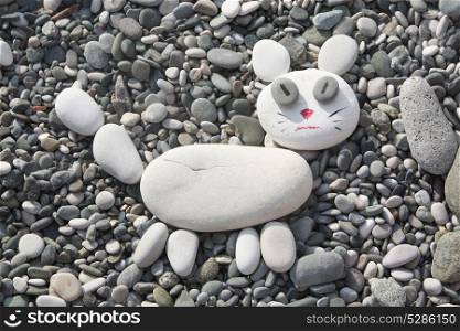 The cat was made of stones on the beach