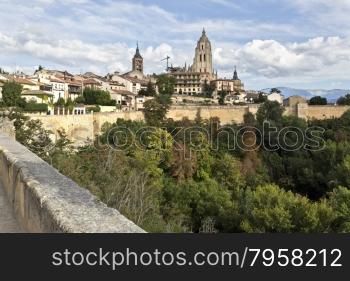 The cathedral and the old citadel seen from the garden of the El Alcazar castle in Segovia, Spain