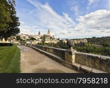 The cathedral and the old citadel seen from the garden of the El Alcazar castle in Segovia, Spain