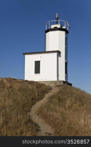 The Cattle Point lighthouse on San Juan Island lies at the end of a winding dirt path that leads up the hill.