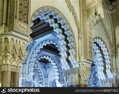 The ceilings of the King Hassan II Mosque in Casablanca, Morocco are filled with decorative arches in a traditional Islamic style.