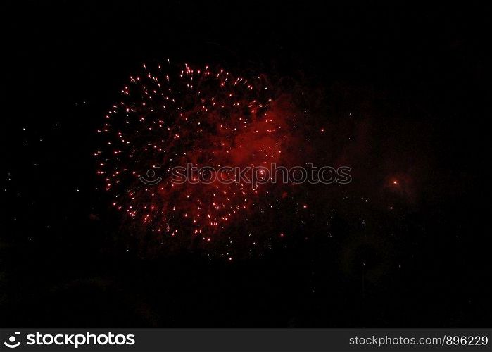 The Celebration colorful firework flashing in the black night sky background