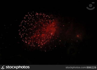 The Celebration colorful firework flashing in the black night sky background