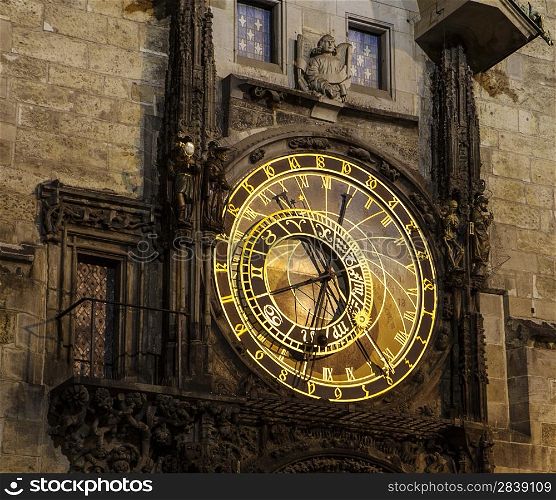 The central portion of the Prague Astronomical Clock (the Orloj) in the Czech Republic has four moving components: the zodiacal ring, an outer rotating ring, an icon representing the Sun, and an icon representing the Moon. It is surrounded by 24 gold Schwabacher numerals that represent the old Czech time.