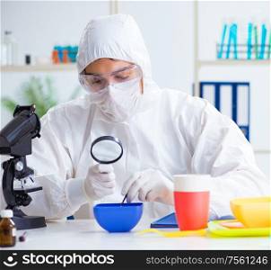 The chemist checking and testing plastic dishes. Chemist checking and testing plastic dishes