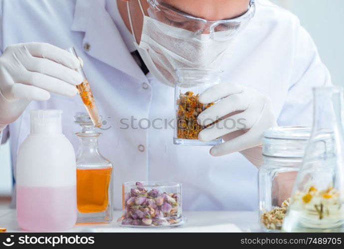 The chemist mixing perfumes in the lab. Chemist mixing perfumes in the lab