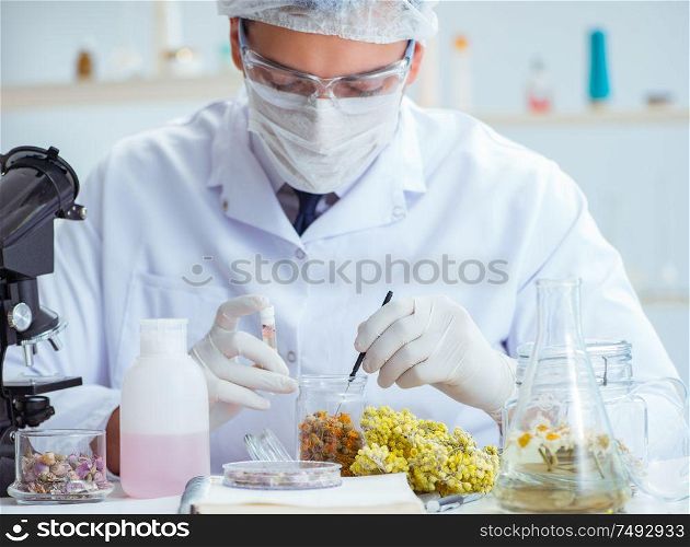 The chemist mixing perfumes in the lab. Chemist mixing perfumes in the lab
