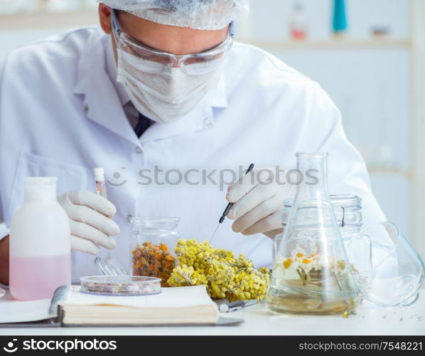 The chemist mixing perfumes in the lab. Chemist mixing perfumes in the lab