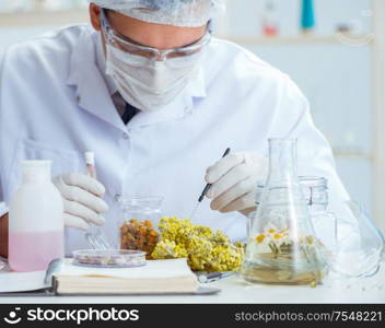 The chemist mixing perfumes in the lab. Chemist mixing perfumes in the lab