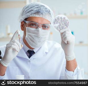 The chemist mixing perfumes in the lab. Chemist mixing perfumes in the lab