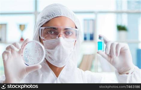 The chemist working in the laboratory with hazardous chemicals. Chemist working in the laboratory with hazardous chemicals