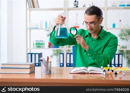 The chemistry student studying for exams. Chemistry student studying for exams