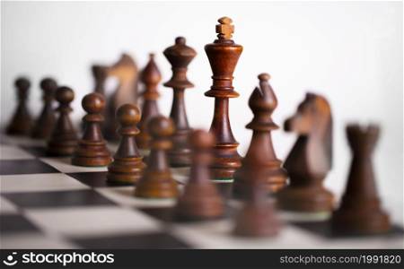 The Chess pieces on a chessboard. The concept of playing and winning a chess tournament. Chess pieces on a chessboard. The concept of playing and winning a chess tournament