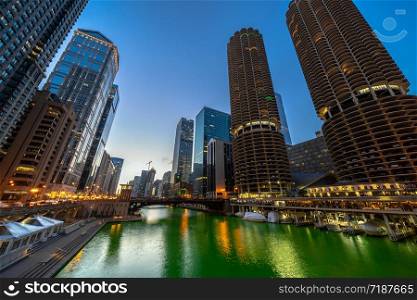 The Chicago riverwalk cityscape river side at the twilight time, USA downtown skyline, Architecture and building with tourist concept