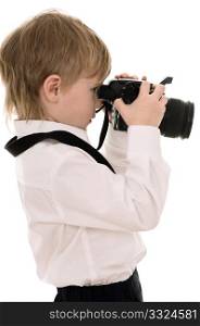 The child in a white shirt with the camera isolated on white background