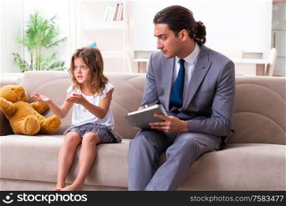 The child psychologist attending small girl. Child psychologist attending small girl