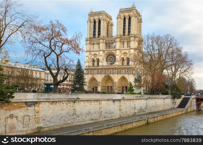 The Christmas tree in front of main west facade of Cathedral of Notre Dame de Paris, France