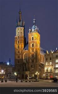 The Church of St Mary in the Main Square (Rynek Glowny) in the city of Krakow in Poland. This gothic basilica is also known as the Church of the Assumption of the Virgin. Dates from the late 13th Century.