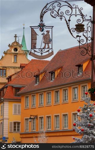The city of Colmar is decorated for Christmas.. Traditional old half-timbered houses in the historic part of the city decorated with Christmas toys. Alsace. France. Colmar.