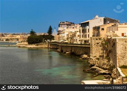The city of Siracusa in Sicily, blue bay.