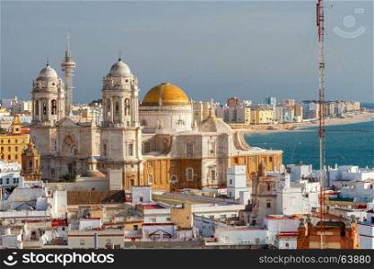 The city's main cathedral in Cadiz.. View of the towers and dome of the cathedral on a sunny day. Cadiz. Spain. Andalusia.