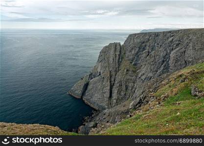 The cliff in North Cape in Mageroya island, the most northerly point of Europe, Norway. North Cape in Mageroya island, Norway