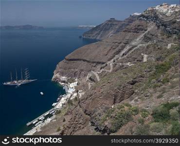 The cliffs and volcanic caldera below the town of Oia on the island of Santorini in the Aegean Sea off the coast of mainland Greece.