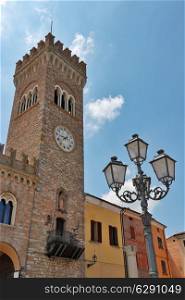 The clock tower on the square of the old Italian city