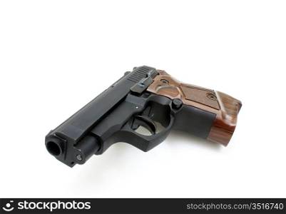 The close up of a pistol a target and cartridges is isolated on a white background