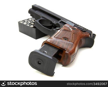 The close up of a pistol a target is isolated on a white background