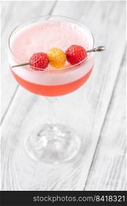 The Clover Club Cocktail garnished with raspberries