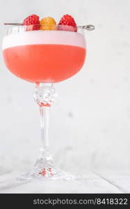 The Clover Club Cocktail garnished with raspberries