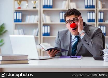 The clown businessman working in the office. Clown businessman working in the office