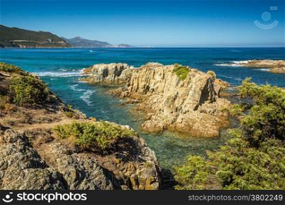 The coast of the Desert des Agriates with L&rsquo;Ile Rousse in backround beach in north Corsica