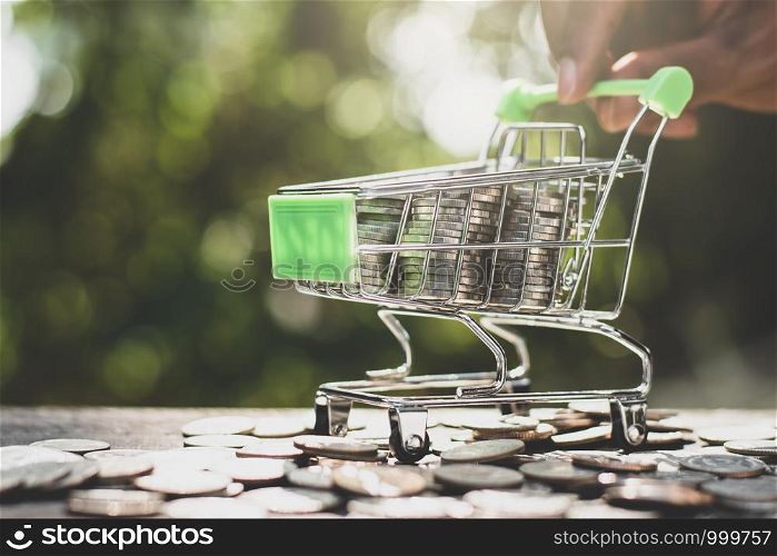 The coins are stacked together in a wheelchair, a small shopping cart.