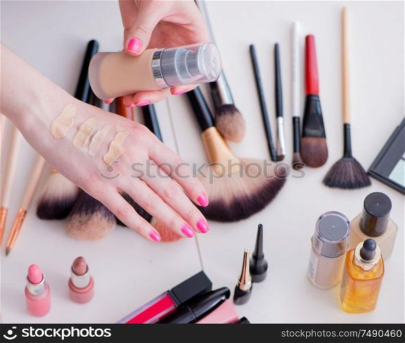The collection of make up products displayed on the table. Collection of make up products displayed on the table