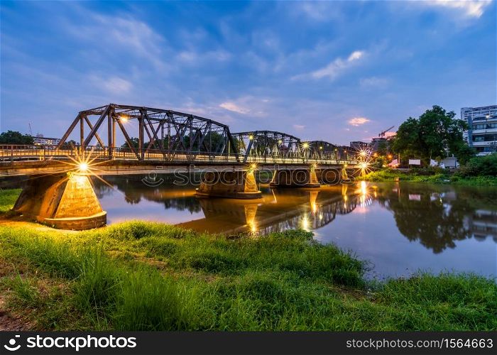 The color of the lights on the Iron Bridge at twlight time is a major tourist attraction in Chiang Mai,Thailand.