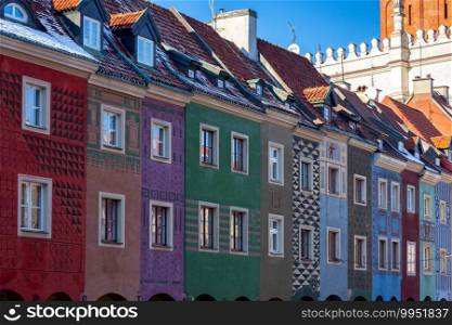 The colorful facades of medieval houses in the market square on a sunny day. Poznan Poland.. Poznan. Market square on a sunny day.