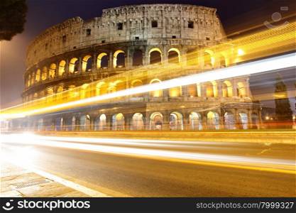 The Colosseum at night and traffic lights, Rome, Italy