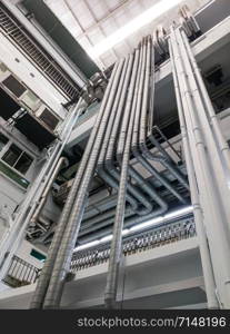 The complex metal pipe of the ventilation system in the large hospital.
