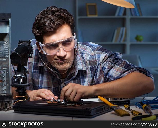 The computer repair concept with man inspecting with stethoscope. Computer repair concept with man inspecting with stethoscope