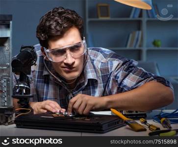 The computer repair concept with man inspecting with stethoscope. Computer repair concept with man inspecting with stethoscope