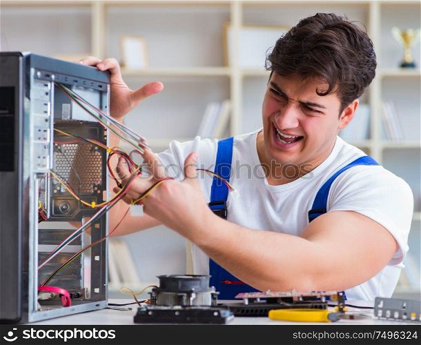 The computer repairman repairing desktop computer. Computer repairman repairing desktop computer