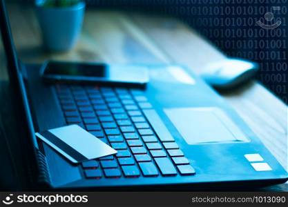 The concept of credit card theft. Hackers with credit cards on laptops use these data for unauthorized shopping. Unauthorized payments from credit card owners. In the hacker&rsquo;s secret office