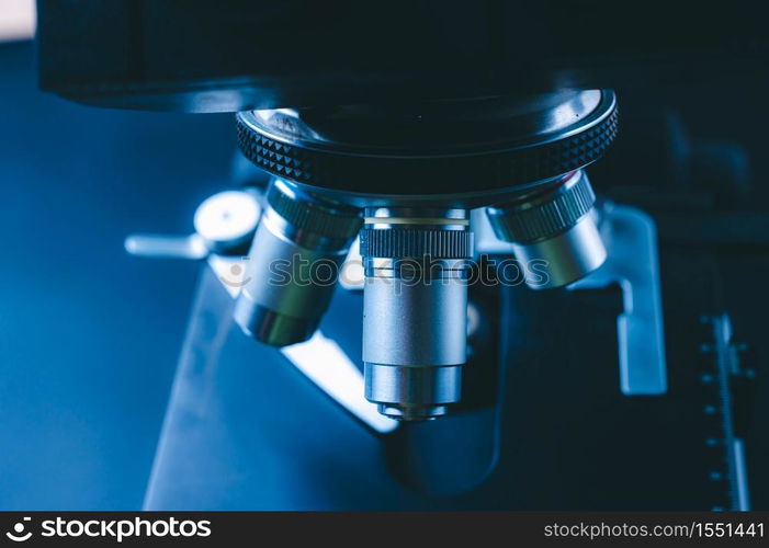 The concept of modern medical laboratory equipment, close up of objective lenses of a microscope