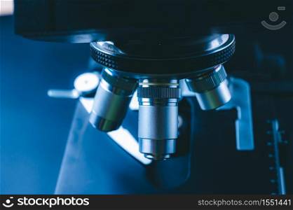 The concept of modern medical laboratory equipment, close up of objective lenses of a microscope