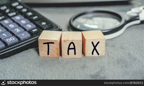 The Concept of taxes paid by individuals and corporations such as VAT, income tax and property tax Data analysis, paperwork,Financial research,TAX on block cubes.