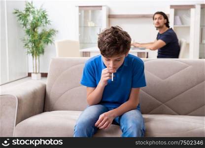 The concept of underage smoking with young boy and family. Concept of underage smoking with young boy and family