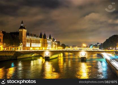 The Conciergerie building in Paris, France in the night